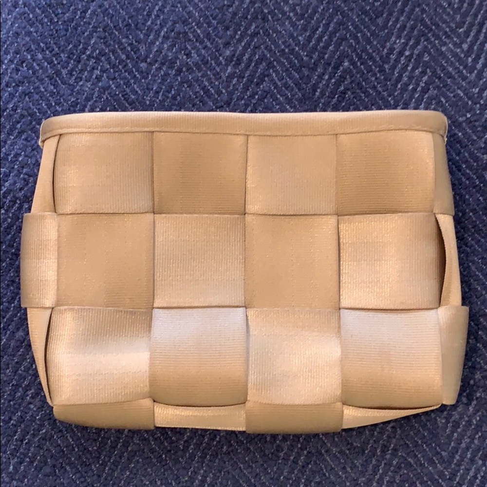 Gold seatbelt clutch